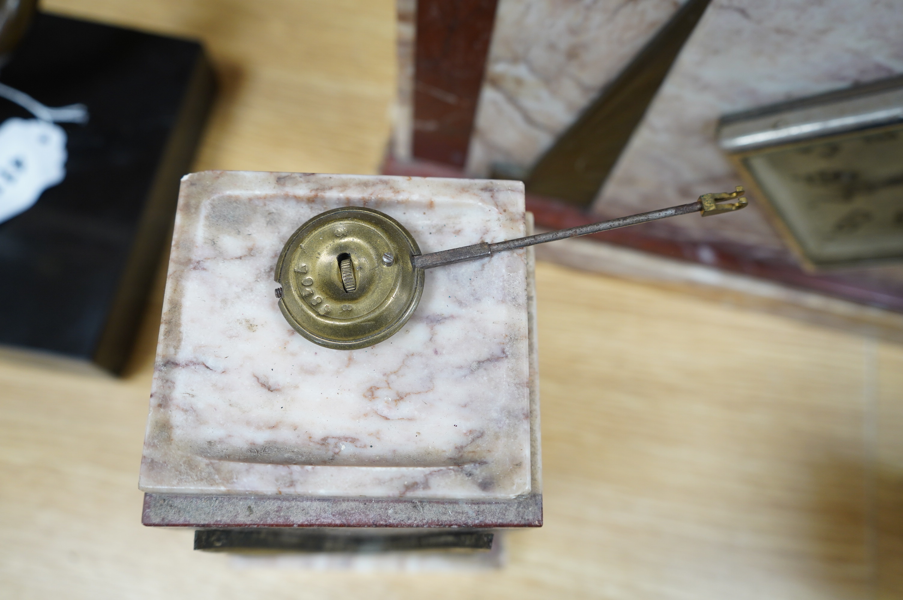 A French Art Deco brass mounted marble clock garniture with figural surmount, clock 38cm wide. Condition - good, unknown if clock working